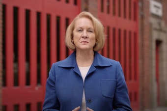 caption: Seattle Mayor Jenny Durkan delivers a brief address about her final city budget proposal as mayor on September 27, 2021.