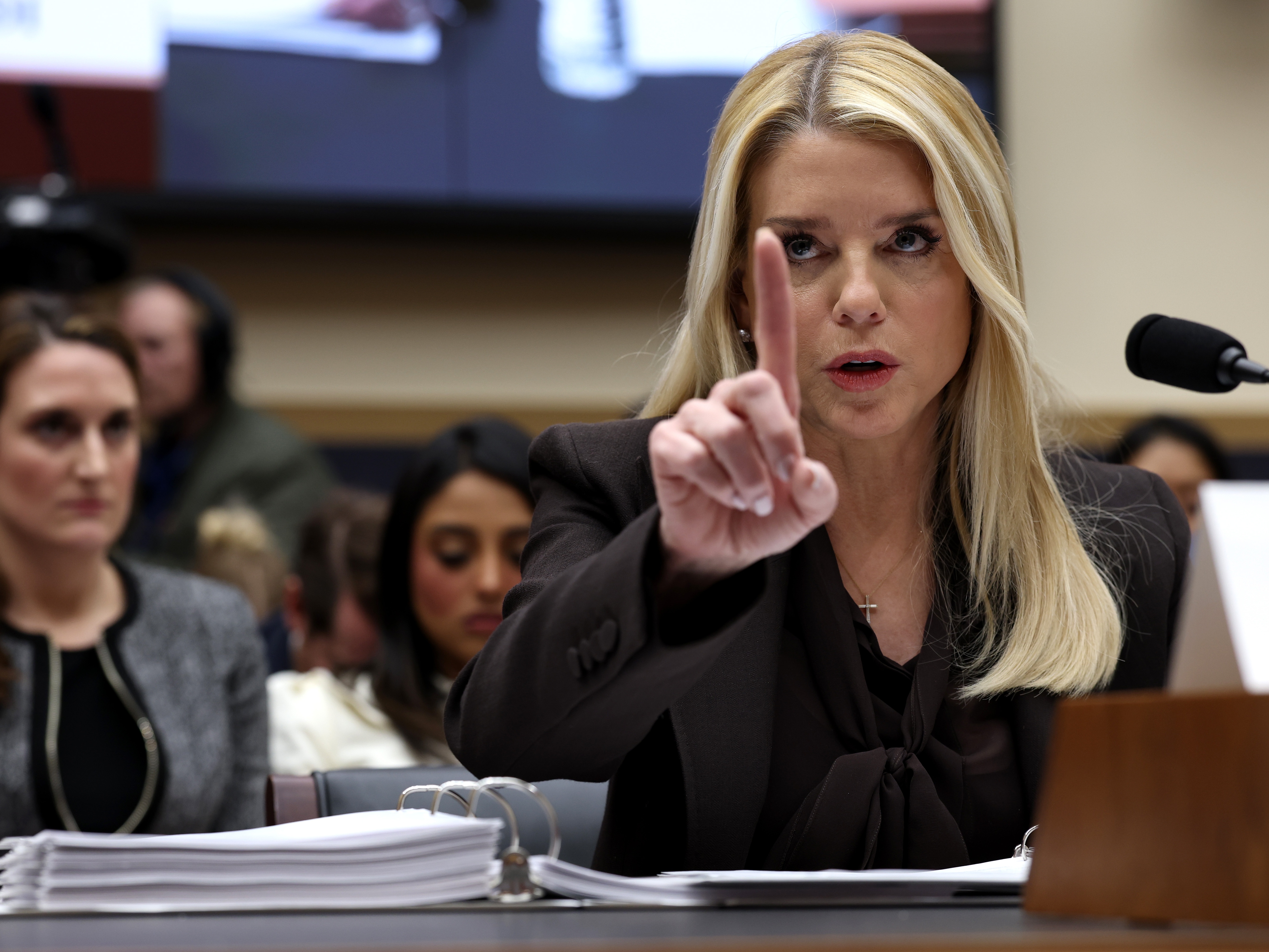 caption: Attorney General Pam Bondi testifies before the House Judiciary Committee in Washington, D.C., on Feb. 11. Bondi has defended the Justice Department's prosecutions during her tenure.