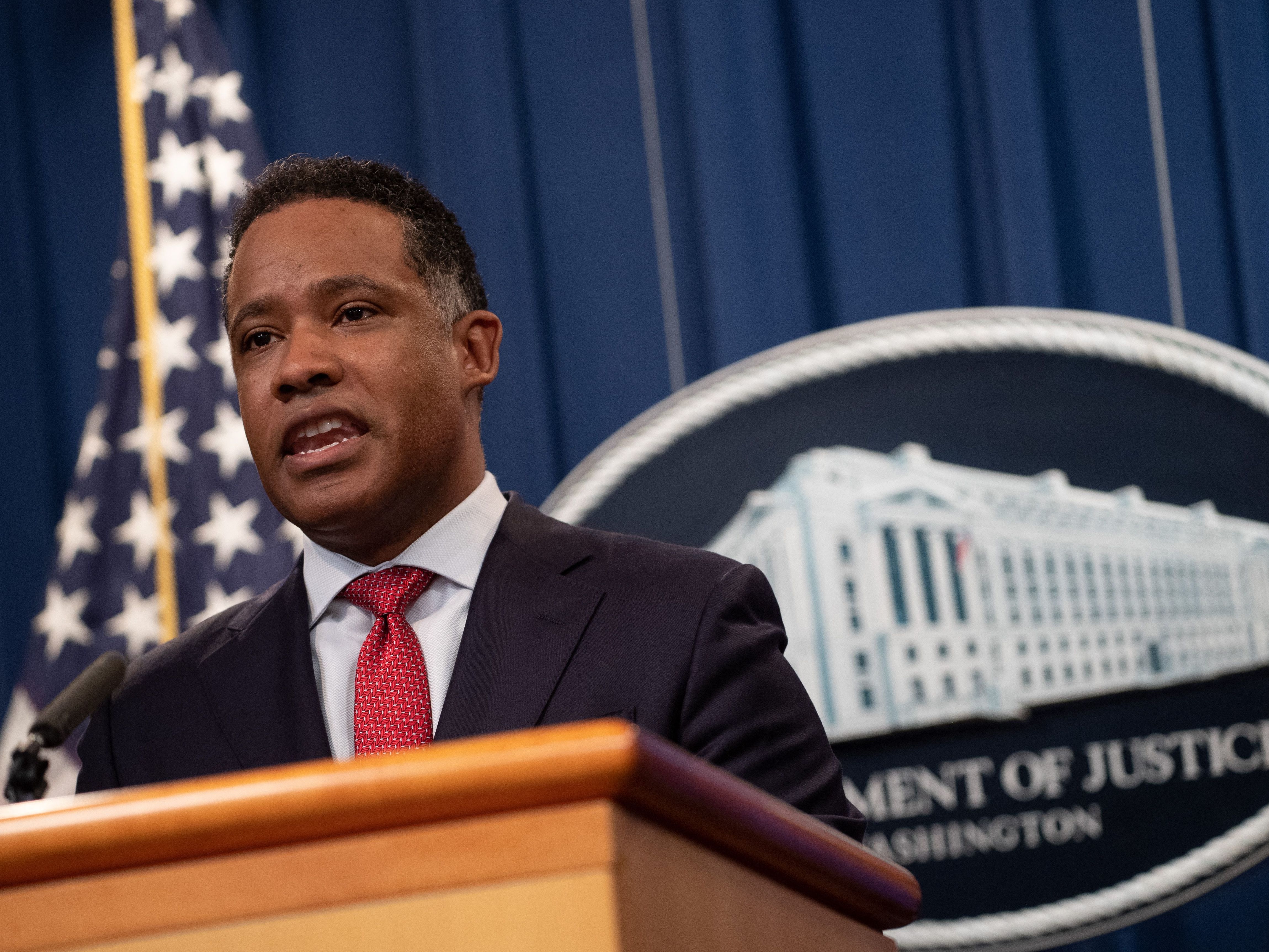 caption: Kenneth Polite, the assistant attorney general of the Justice Department's Criminal Division, speaks during a news conference at the department in October.