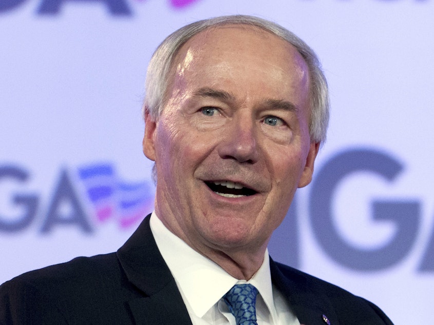 caption: Arkansas Gov. Asa Hutchinson speaks at a National Governors Association meeting last year. A federal judge late Tuesday temporarily blocked abortion restrictions signed into law by Hutchinson in March.