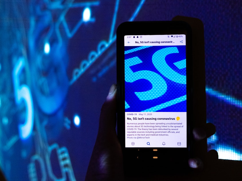 caption: Open up any social media app on your phone and you'll see it: links to COVID-19 information from trustworthy sources. Here, a Twitter screen reads, "No, 5G isn't causing coronavirus."