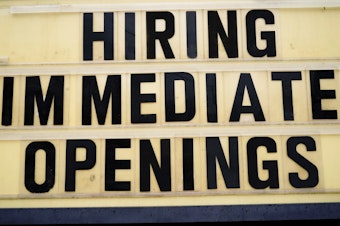 caption: A hiring sign is posted outside business in Huntingdon Valley, Pa., on Feb. 22. Employers are keen for workers as the economy continues to recover from the pandemic.