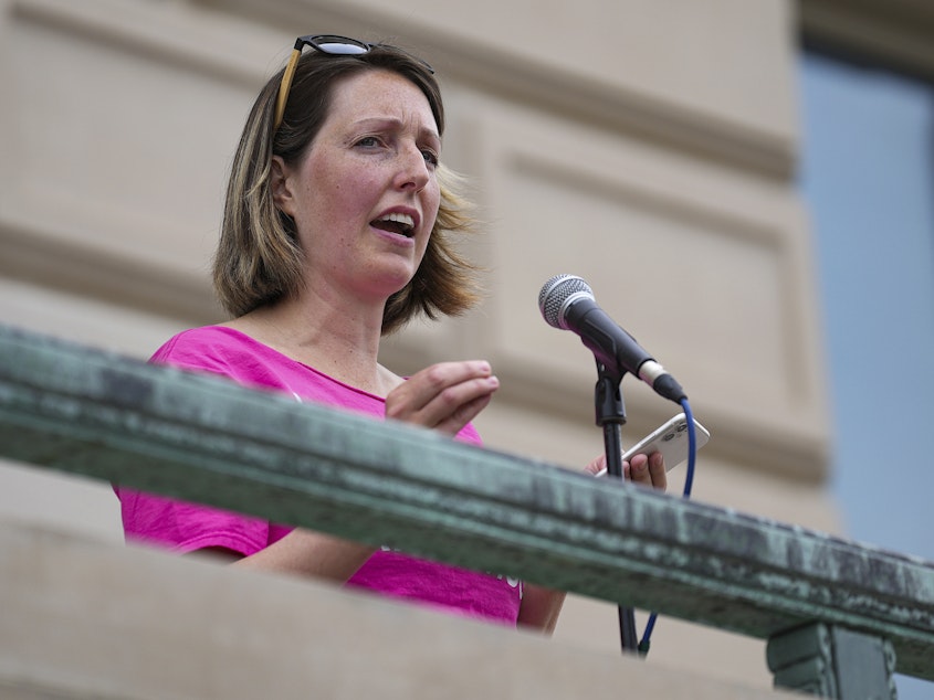 caption: Dr. Caitlin Bernard, a reproductive healthcare provider, speaks during an abortion rights rally on June 25, 2022, at the Indiana Statehouse in Indianapolis.