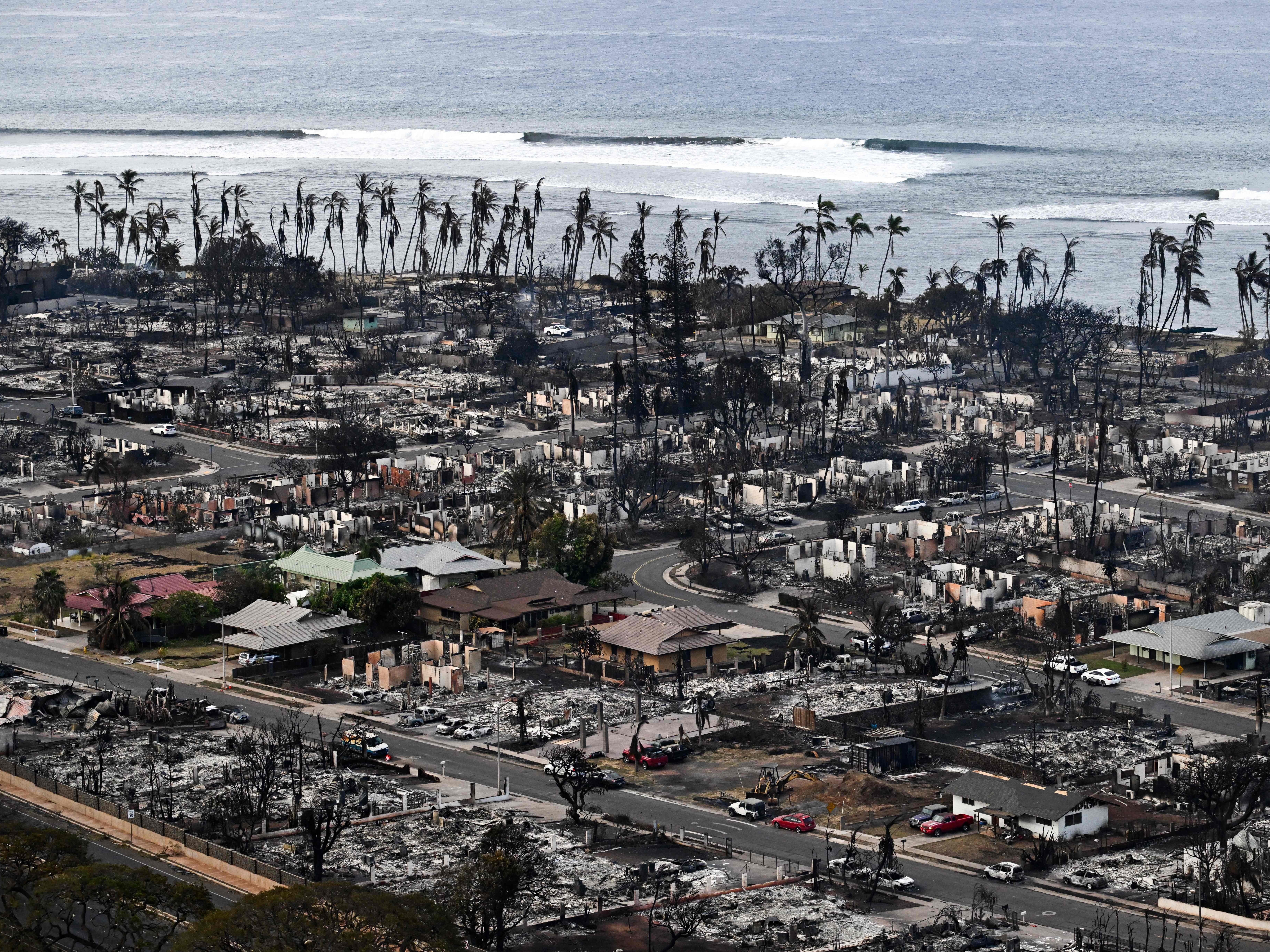 caption: An aerial image taken on Friday shows destroyed homes and buildings burned to the ground in Lahaina in the aftermath of wildfires in western Maui, Hawaii, on August, 2023.