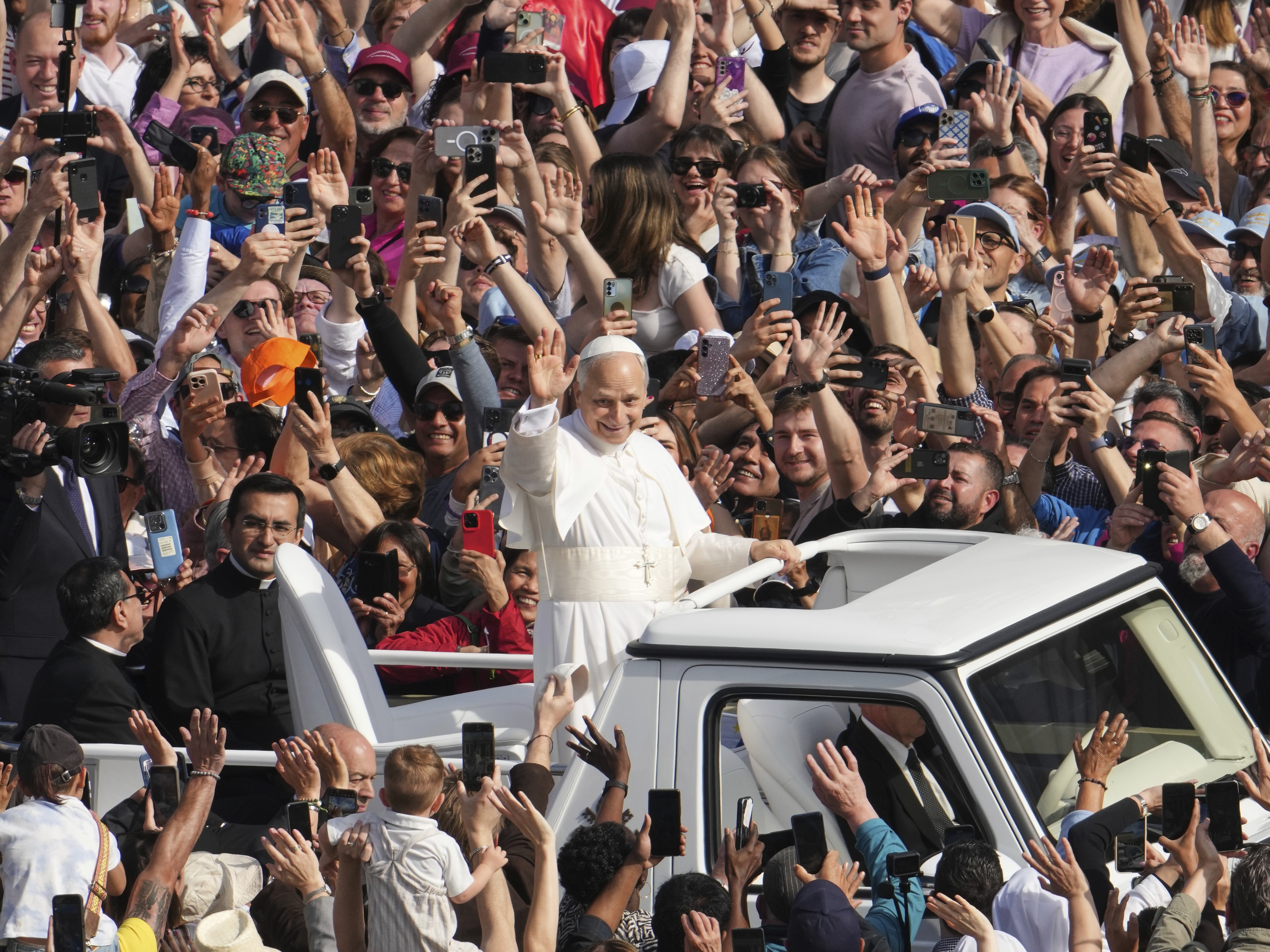 caption: Pope Leo XIV on his popemobile tours St. Peter's Square at the Vatican prior to the inaugural Mass of his pontificate, Sunday, May 18, 2025.