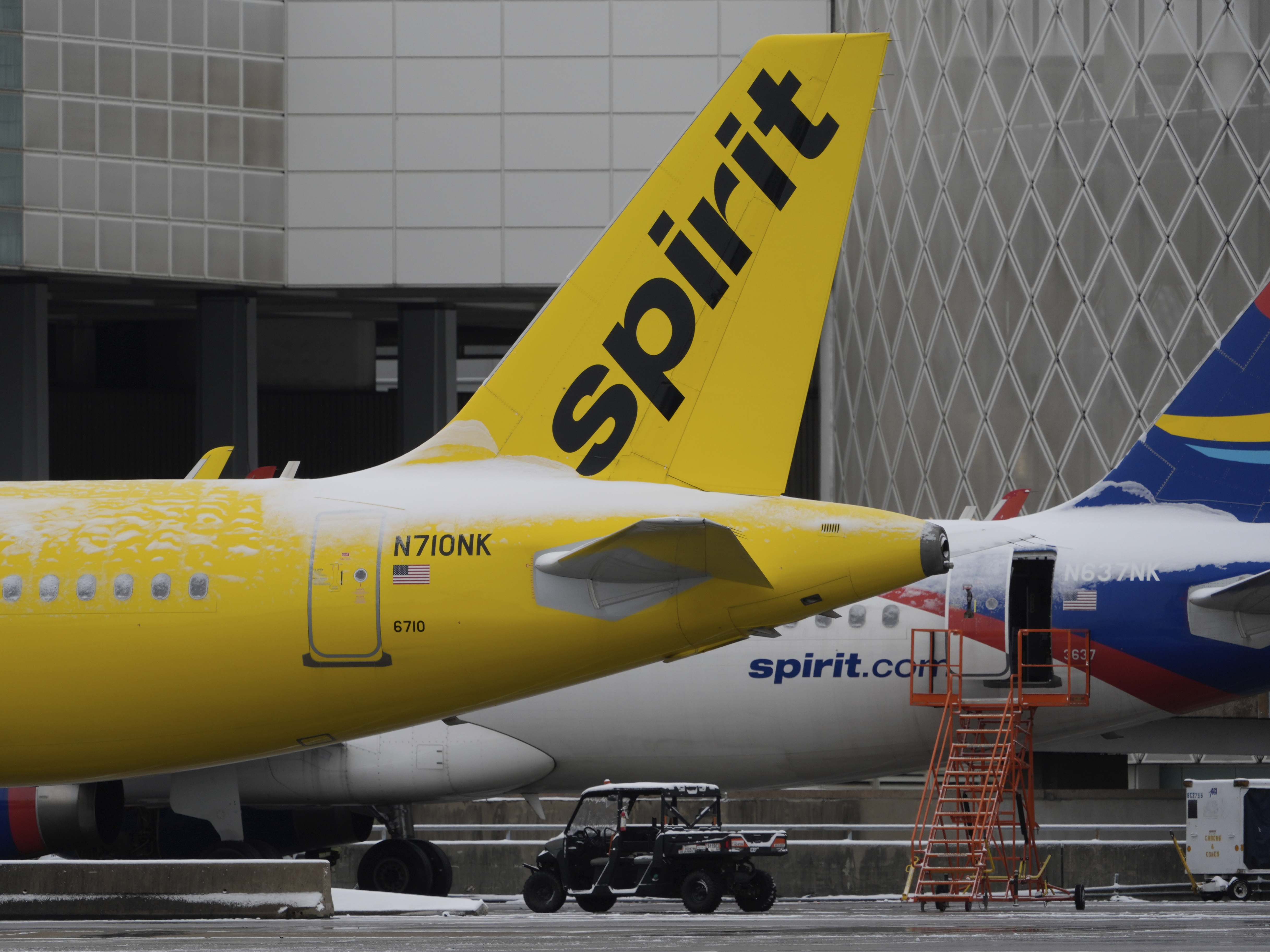 caption: Spirit Airlines planes parked at the closed George Bush Intercontinental Airport, Jan. 21, 2025, in Houston.