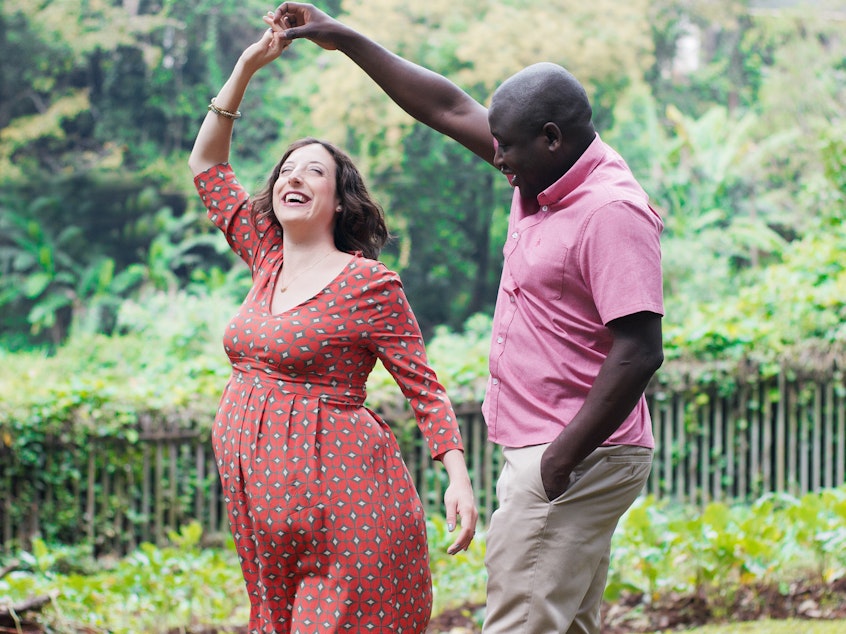 caption: Kennedy Odede and Jessica Posner Odede during their countdown to parenthood.