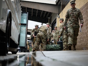 caption: Troops from the Army's 82nd Airborne Division prepare to deploy to the Middle East on Saturday at Fort Bragg, N.C.