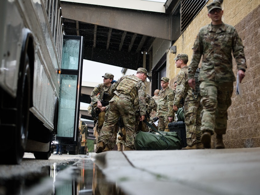 caption: Troops from the Army's 82nd Airborne Division prepare to deploy to the Middle East on Saturday at Fort Bragg, N.C.