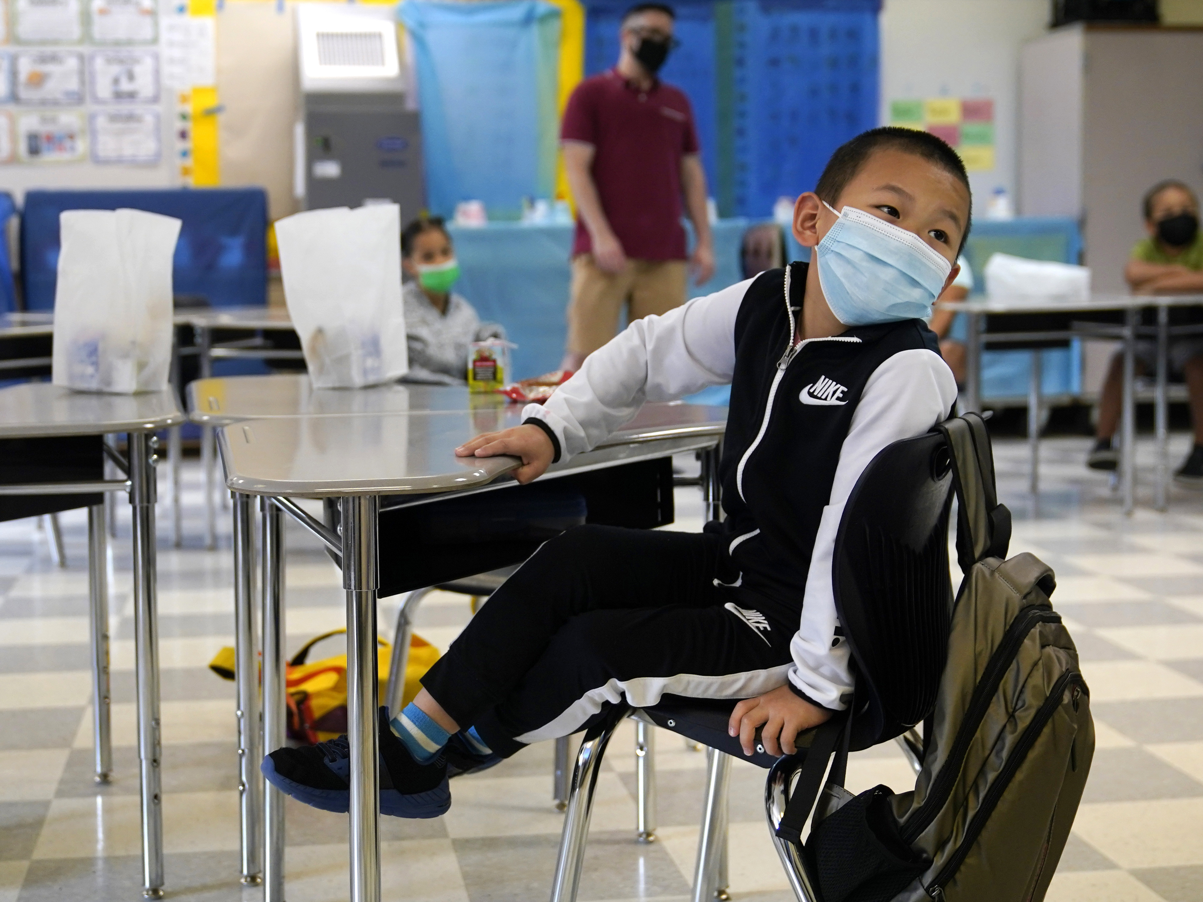 caption: A student attends summer classes at E.N. White School in Holyoke, Mass. In a new survey of school superintendents, 75% of respondents said they were using federal COVID-19 relief dollars to pay for summer learning and other enrichment activities.