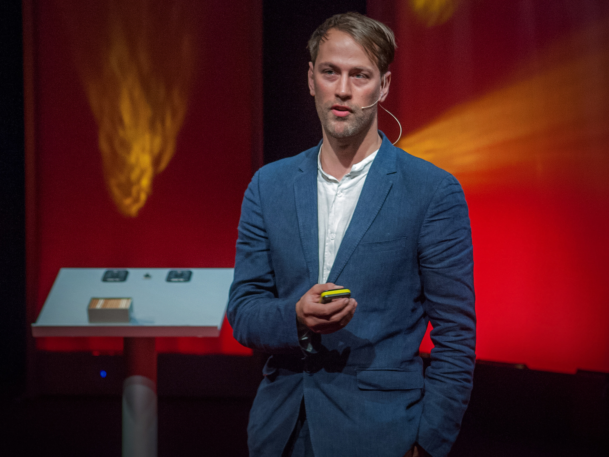 caption: Tristram Stuart on the TED stage.