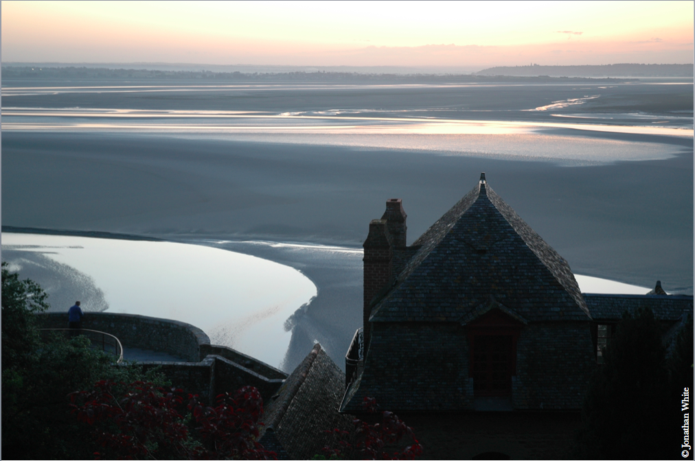 caption: Monastery at Mont St. Michel, France, low tide