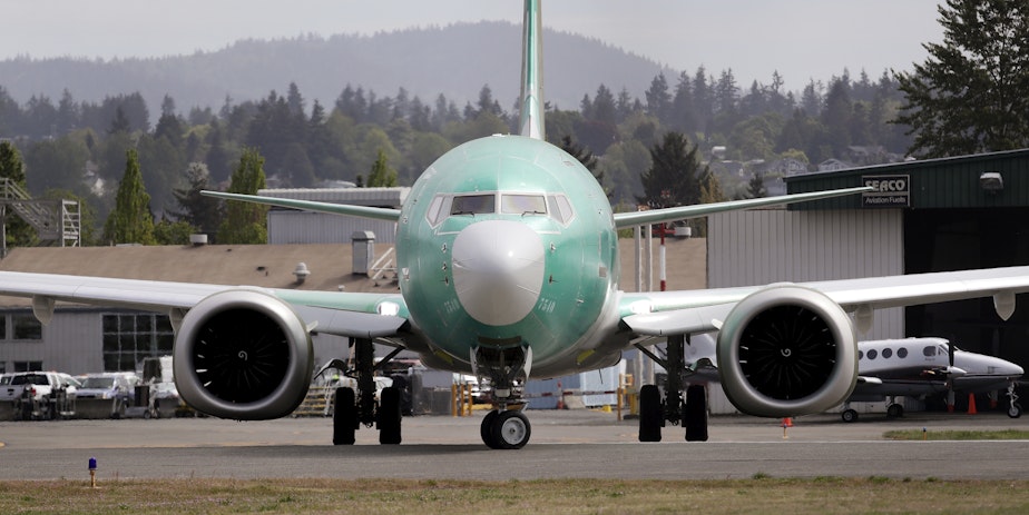 caption: FILE - In this may 8, 2019 photo, a Boeing 737 MAX 8, being built for American Airlines, makes a turn on the runway as it's readied for takeoff on a test flight in Renton, Wash. 