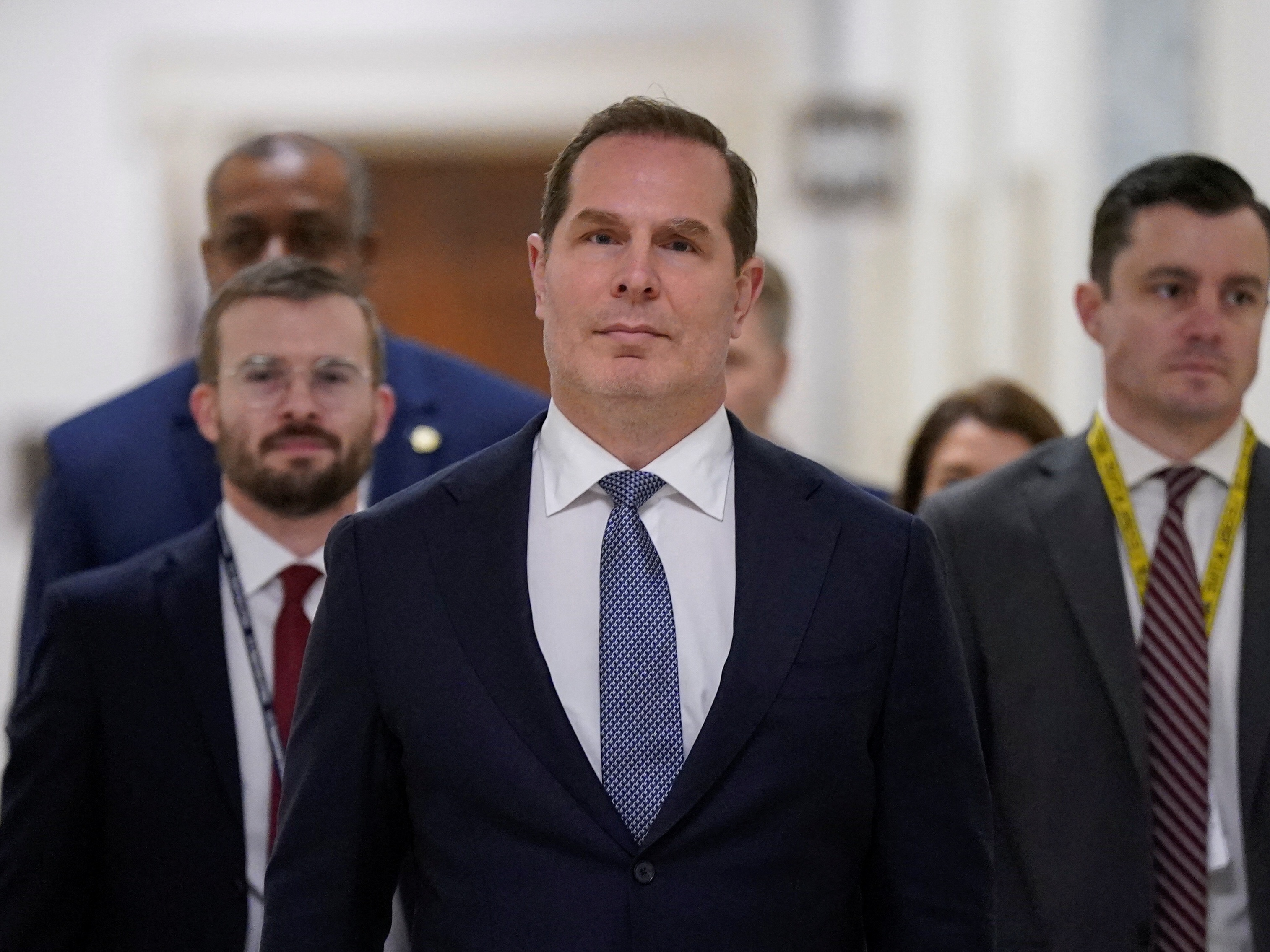 caption: Pete Marocco (center), who served as deputy administrator for USAID in the new Trump administration until last week, arrives at Capitol Hill on March 5 to meet with members of Congress to discuss foreign assistance. He was on staff at the agency during the first Trump administration — and both times sought to cut many of its programs.