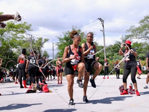 caption: Women, aged 40 and older, gathered in Chicago to jump Double Dutch during the club's annual playdate.