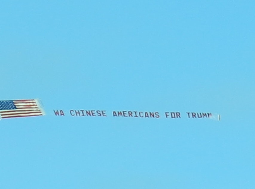 caption: This banner flew over Seattle on Oct. 28. It reads, WA Chinese for Trump.