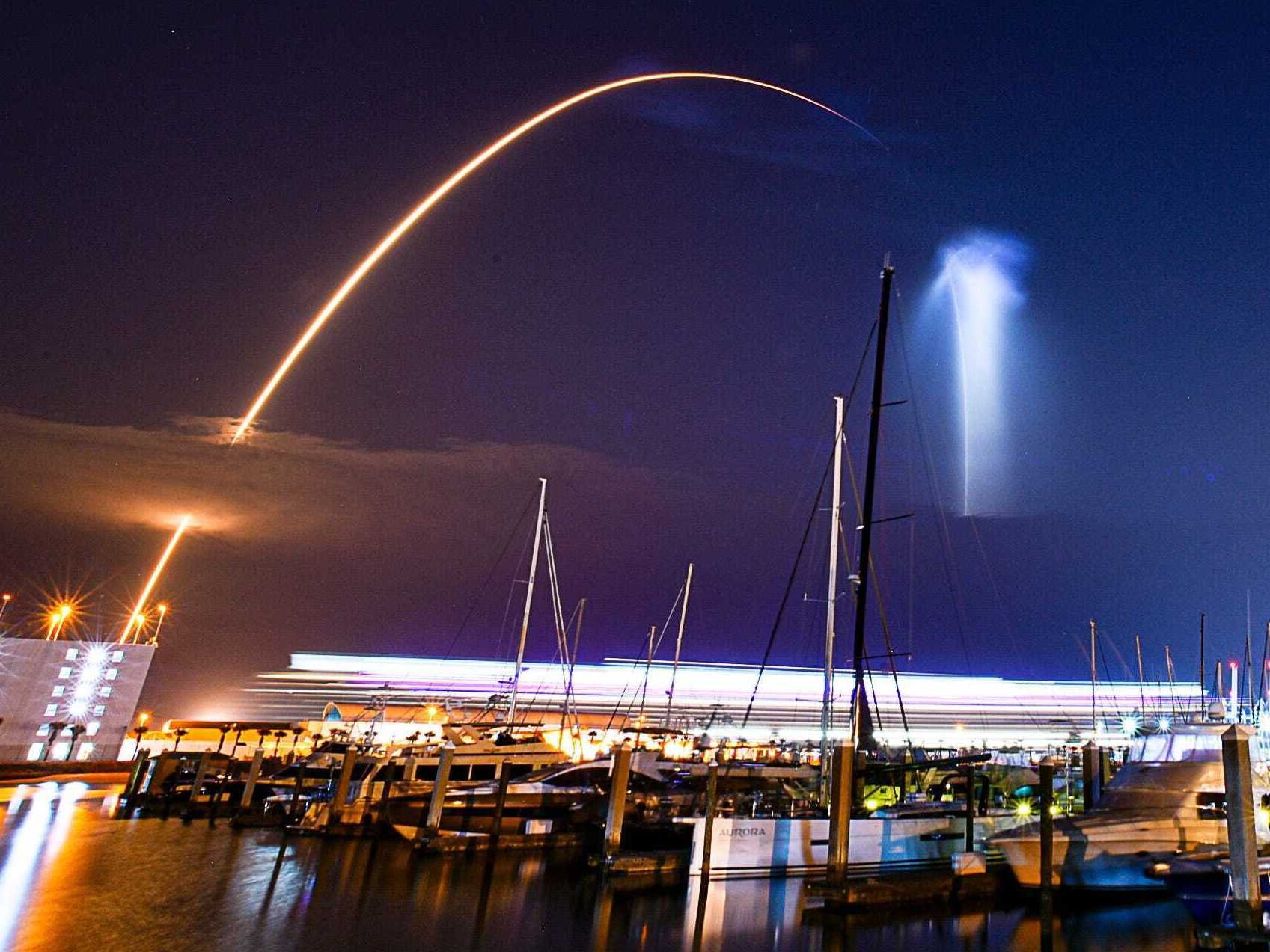 caption: A SpaceX Falcon 9 rocket lifted off from pad 39A at Kennedy Space Center early Friday morning. This time exposure image captured the 'space jellyfish" effect of the contrail viewed from Port Canaveral Marine. The white streak on the horizon was caused by light from a cruise ship coming into port.