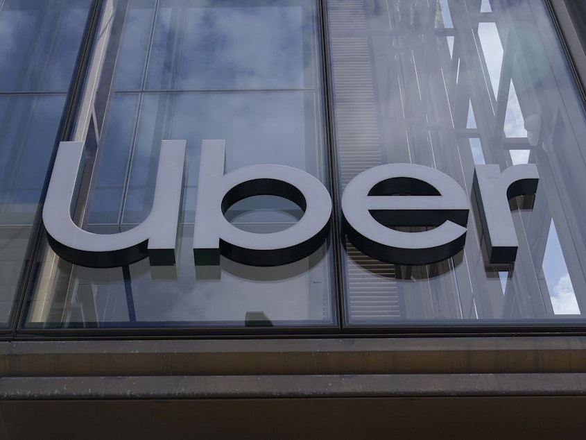 caption: An Uber sign is displayed at the company's headquarters in San Francisco on Monday.