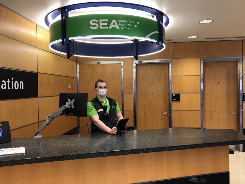 caption: Starting Monday, May 18th Sea-Tac mandates travelers wear a face mask and follow certain social distancing measures at the airport. 