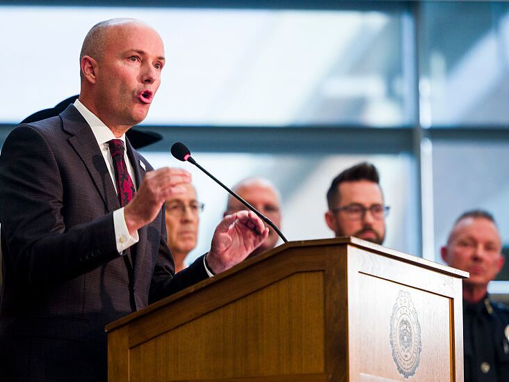 caption: Utah Gov. Spencer Cox speaks at a press conference flanked by FBI Director Kash Patel following the fatal shooting of political activist Charlie Kirk on Friday in Orem, Utah.
