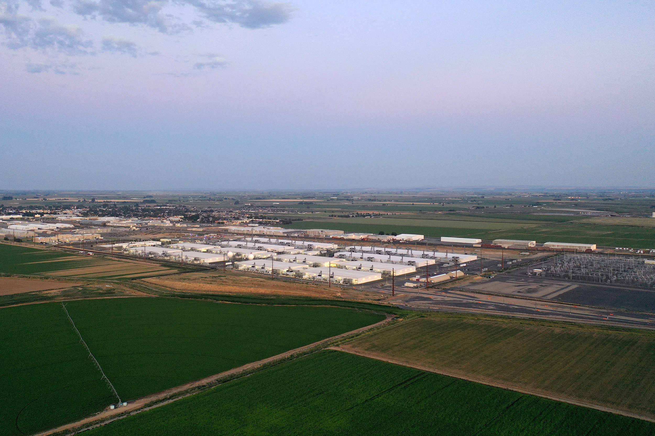 caption: An aerial view of a Microsoft data center is shown on Thursday, July 17, 2025, in Quincy, Washington. 