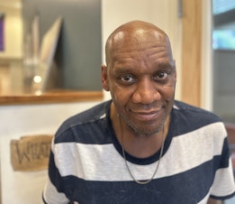 caption: Darryl Lee lives in the First Hill neighborhood, at Plymouth Housing, which offers supportive housing for people who were chronically homeless. 