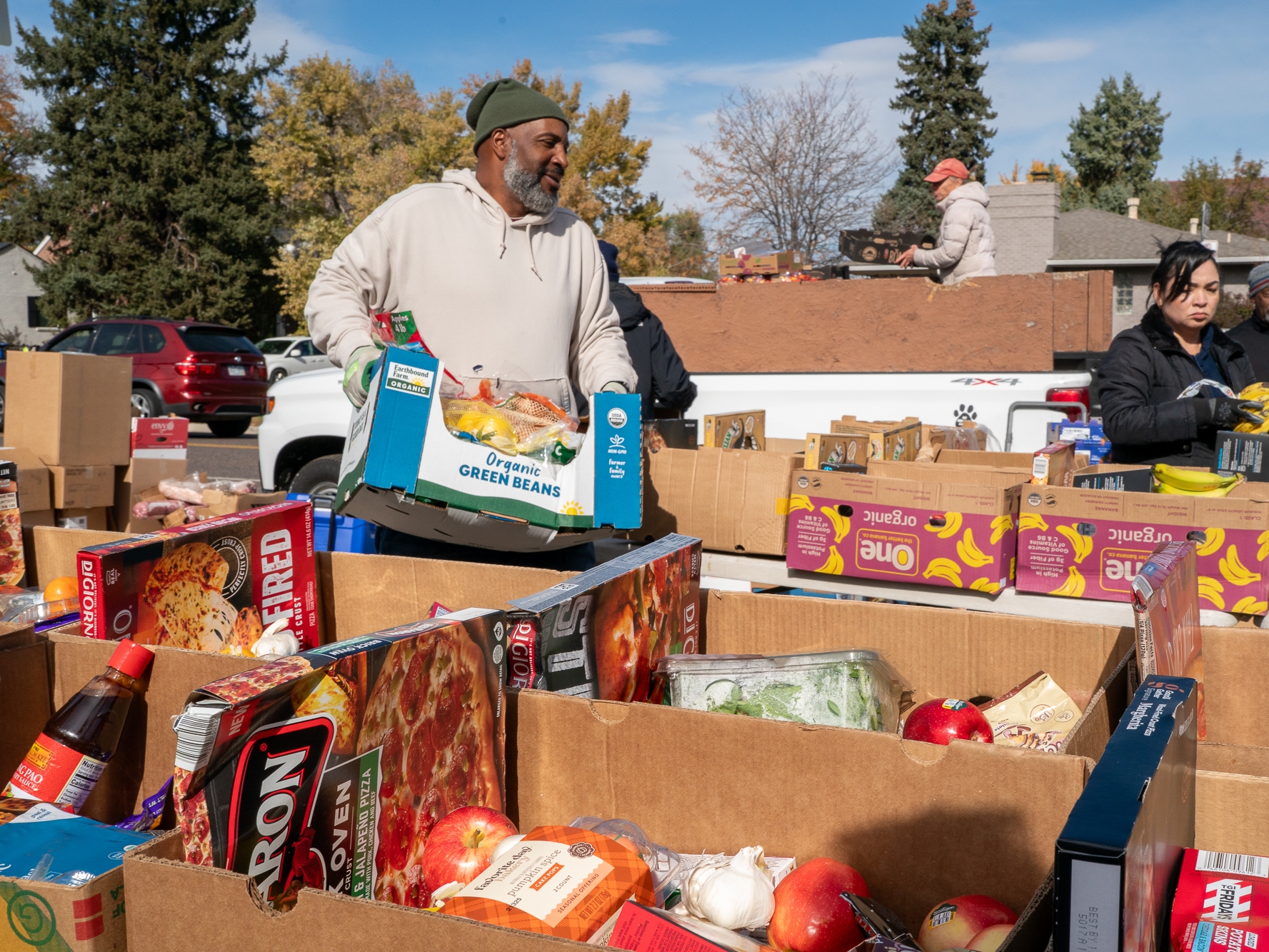 caption: Food banks around the country are trying to pick up the slack from the pause in SNAP benefits. The courts say benefits must be restored but it is unknown when. Here, Park Hill Food Pantry volunteers in Denver work to fill the need on Friday.