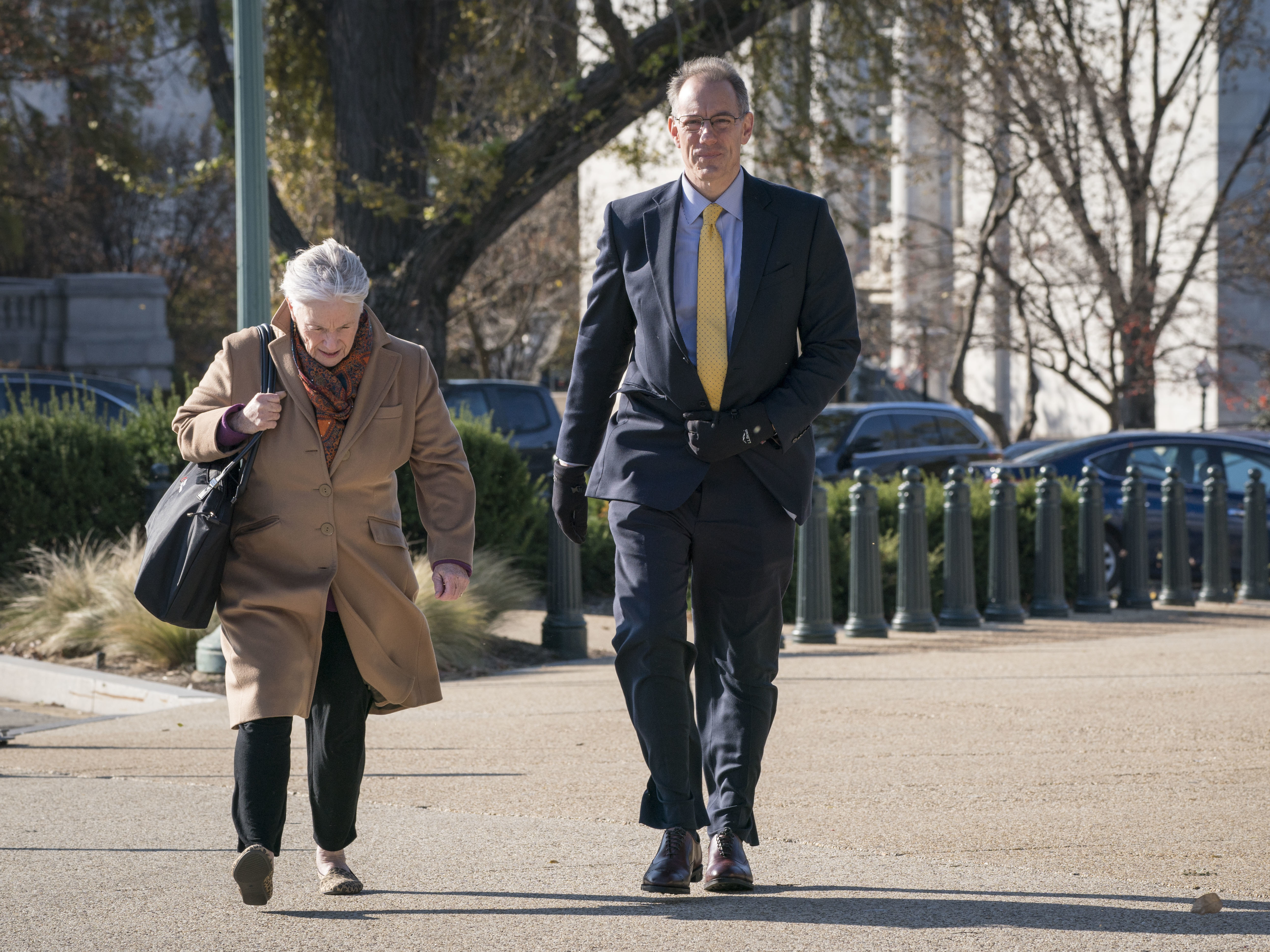 caption: Mark Sandy, a senior career official at the Office of Management and Budget, outside the Capitol before his close-door deposition last month.