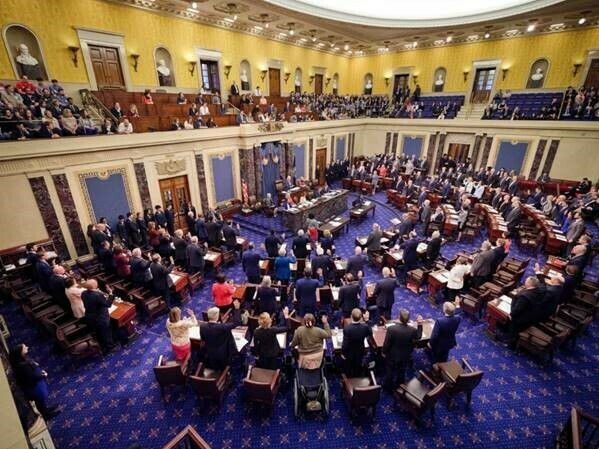 caption: An official Senate photographs shows senators taking the oath at the start of the Senate impeachment trial on Wednesday.