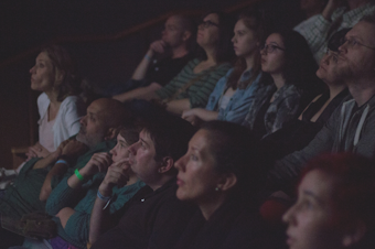 caption: An audience watches a film at the Seattle Deaf Film Festival in 2016. The festival is held every two years and features authentic representations of the Deaf and Hard of Hearing community. 