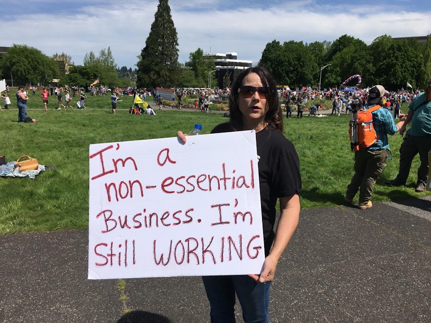 caption: Terrisa Remmers has been operating her dog grooming business in violation of Gov. Jay Inslee's order shuttering nonessential businesses. "I will not lose my business of 31 years," Remmers said at Saturday's rally.