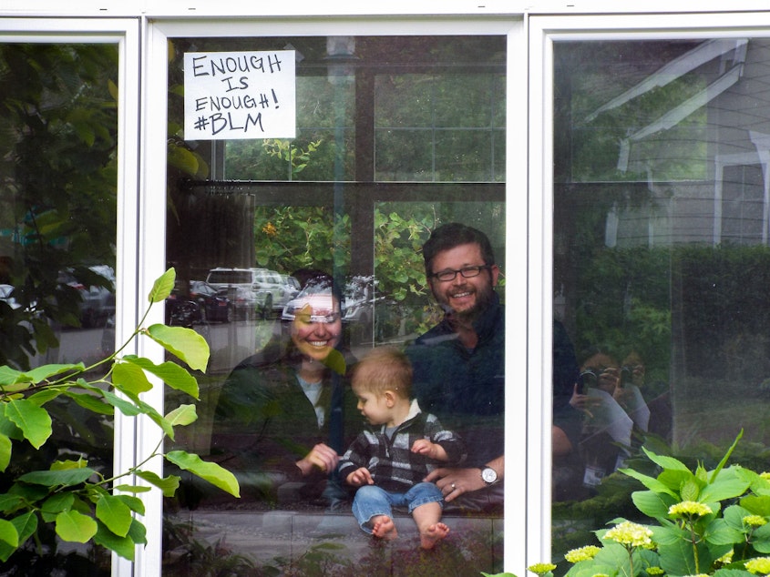 caption: At a quick glance, one might not notice the handmade sign with the words, “Enough is Enough! #BLM.” The Jensens have taken to actions like this one to show their support for the Black Lives Matter Movement.
