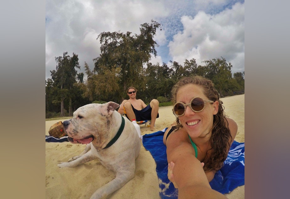 Mary Finley, Travis Sherman and Tonka at the beach. 'I'm fearful of the world that we are making for ourselves,' Travis said. 'That's why I don't want to have children.'