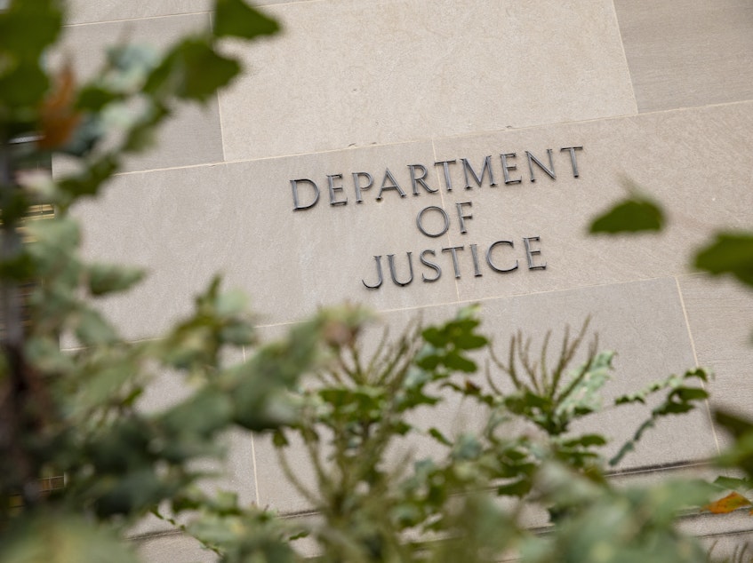 caption: The Justice Department building on a foggy morning in 2019 in Washington, D.C.