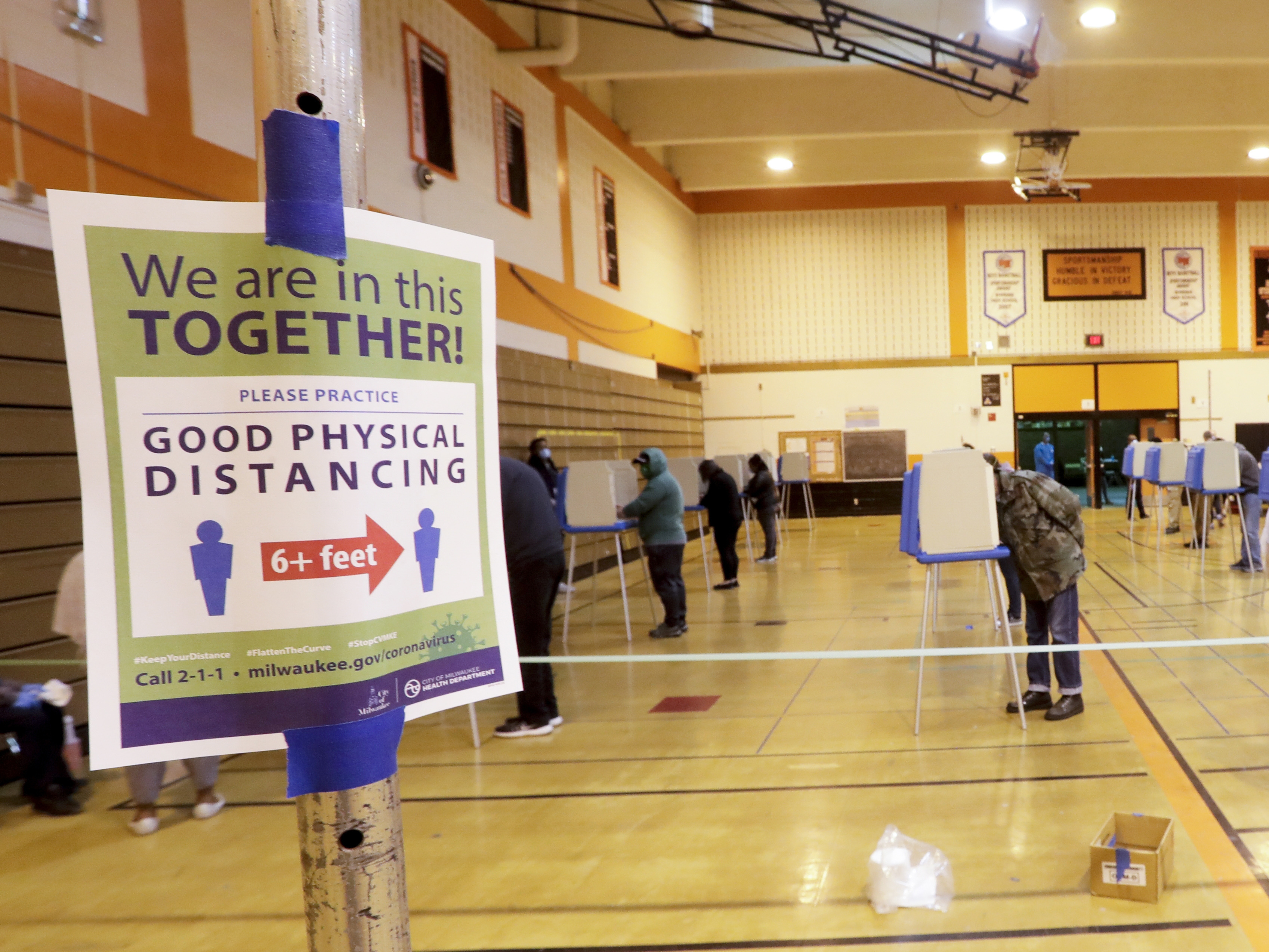 caption: Voters cast ballots at Riverside High School during Wisconsin's primary election on Tuesday in Milwaukee. It's the only state to hold a major election since stay-at-home orders were issued across most of the country.