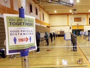 caption: Voters cast ballots at Riverside High School during Wisconsin's primary election on Tuesday in Milwaukee. It's the only state to hold a major election since stay-at-home orders were issued across most of the country.