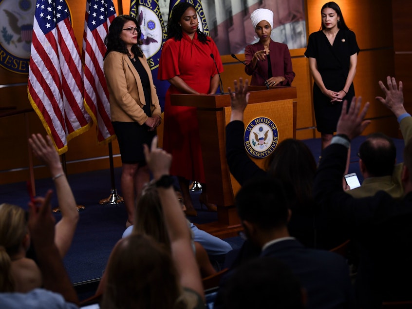caption: US Representatives Rashida Tlaib (D-MI), Ayanna Pressley (D-MA), Ilhan Omar (D-MN) and Alexandria Ocasio-Cortez (D-NY) hold a press conference at the US Capitol in Washington, DC on July 15, 2019 to address remarks made by President Donald Trump.