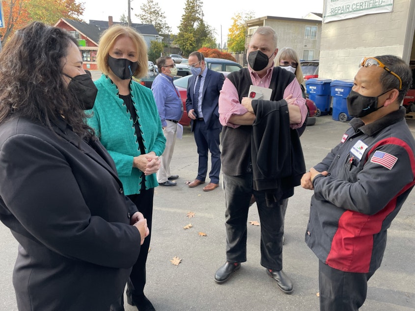 caption: SBA Administrator Isabelle Guzman (L) and Seattle Mayor Jenny Durkan (2nd from L) speak with Philip Nguyen, owner of Rose Street Auto Repair