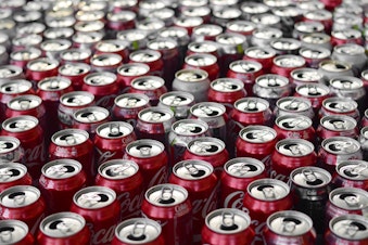 caption: File photo of Coca-Cola cans
