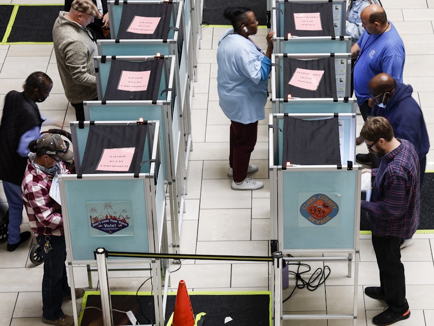 Voters stand in voting booths as they fill out their ballots at a polling center at the Meadows Mall on Nov. 8, 2022 in Las Vegas.