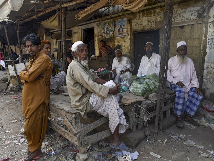 caption: Above: Pakistan is home to millions of ethnic Bengalis, many of whom remain stateless, with none of the rights granted to citizens. Like many stateless peoples, they may live in slums where they bear the brunt of climate change impacts, but they're often overlooked in efforts to help those who are suffering.