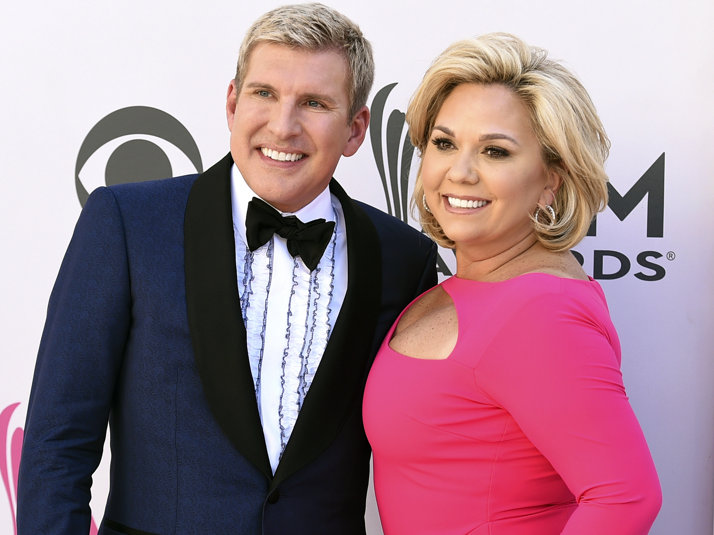 caption: Trump announced Tuesday that he will grant full pardons to reality TV stars Todd and Julie Chrisley, pictured in 2017.
