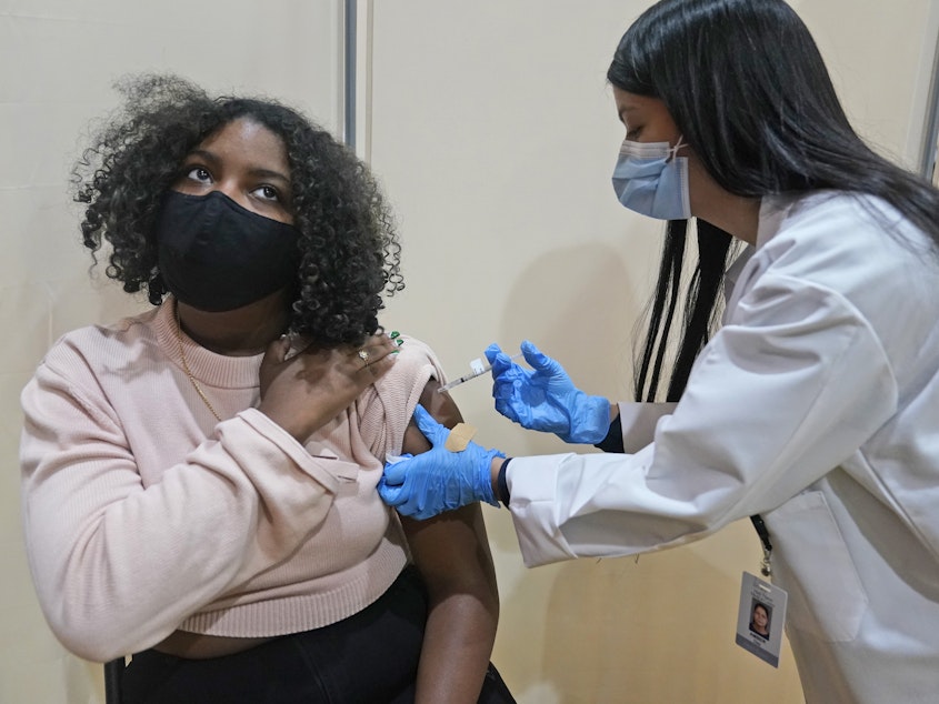 caption: Keidy Ventura, 17, receives her first dose of the Pfizer COVID-19 vaccine in West New York, N.J. Pfizer has asked federal regulators to expand the eligibility for booster shots to include 16- and 17-year-olds.