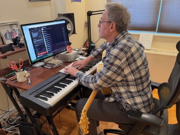 caption: Songs of Love Foundation founder and president John Beltzer uses tools from the AI music platform Suno to create a personalized track for an older adult with dementia.