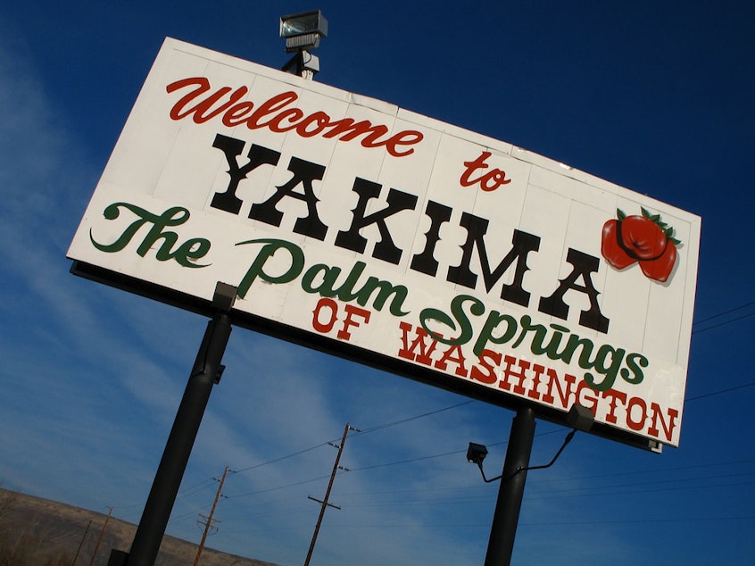 caption: A sign on Interstate 82 welcomes visitors to Yakima