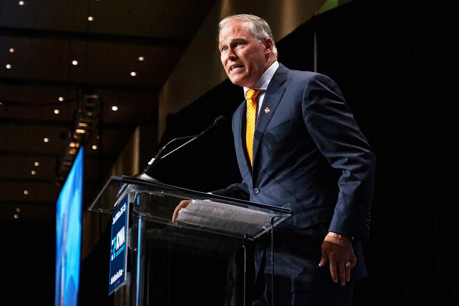 caption: Washington Gov. Jay Inslee speaks at the Iowa Democratic Party Hall of Fame event on June 9, 2019 in Cedar Rapids, Iowa.