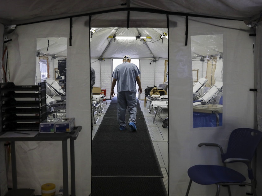 caption: A temporary tent was set up at UMass Memorial Hospital in Worcester, Mass., to prepare for an uptick in COVID-19 cases this month.