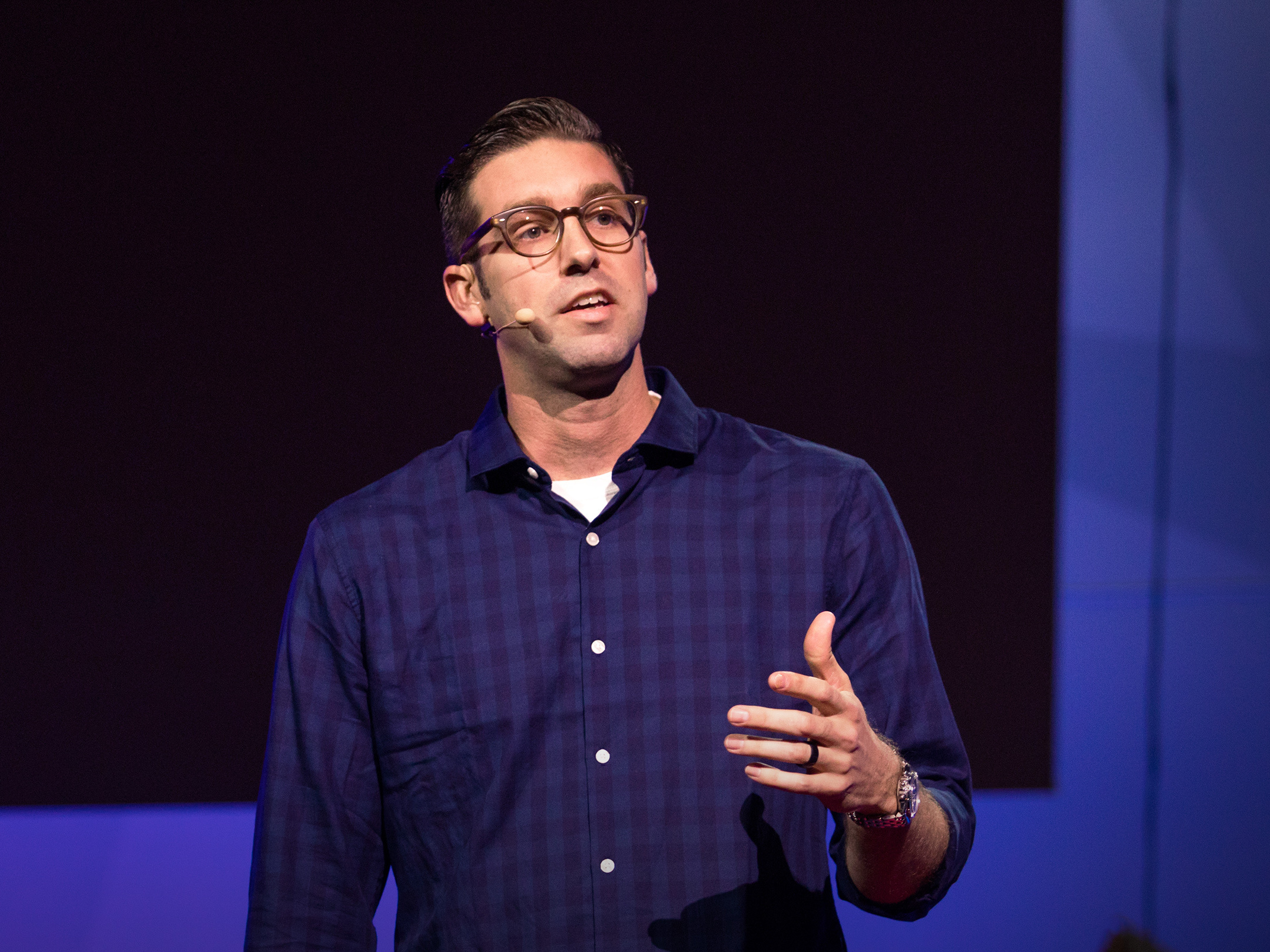 caption: Jon Bowers on the TED stage.