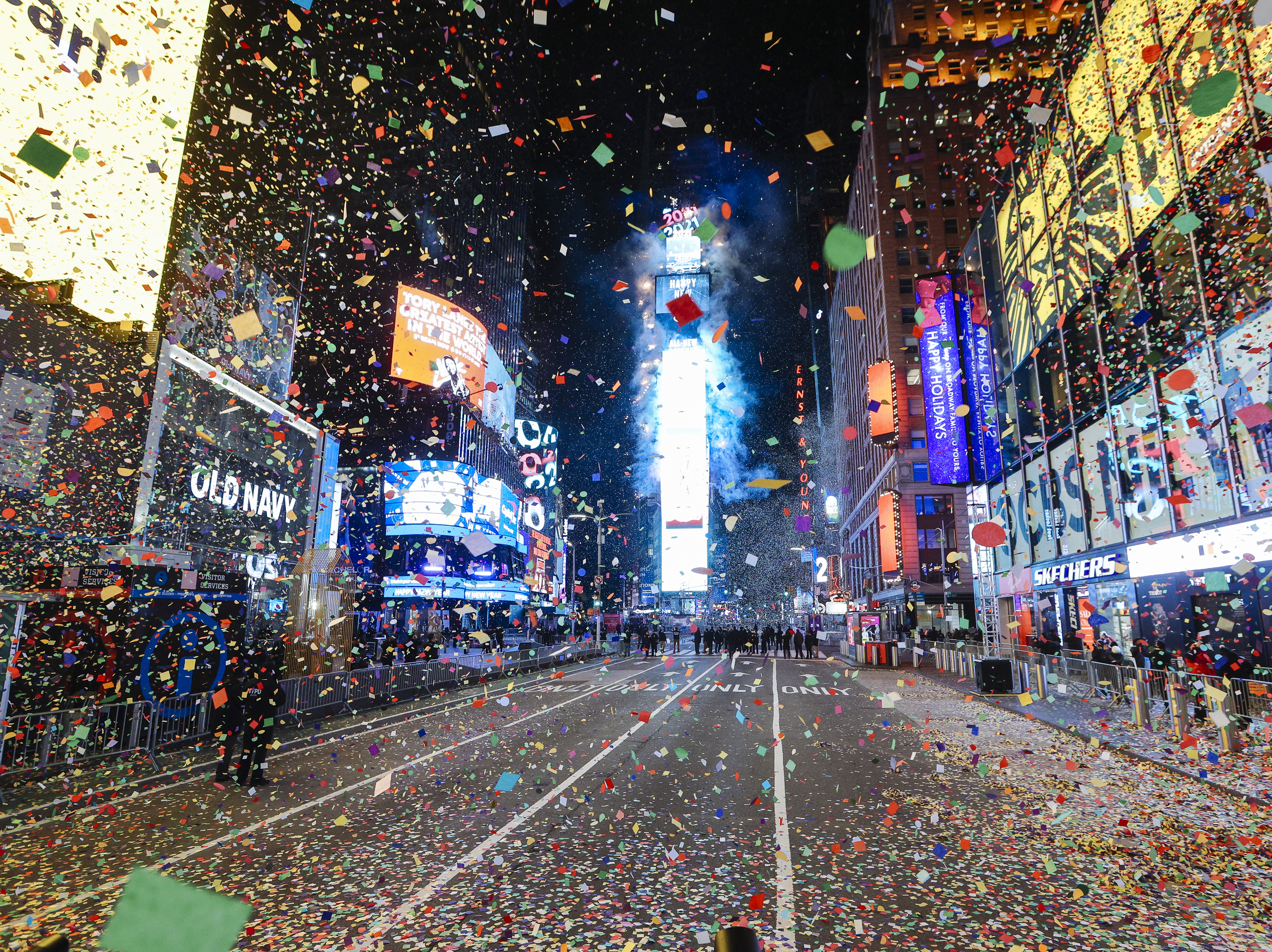 caption: Confetti falls at midnight during a virtual New Year's Eve celebration in New York City's Times Square on Jan. 1, 2021. The annual New Year's Eve ball drop event, which typically draws more than 1 million people, was closed to the public due to the COVID-19 risk.