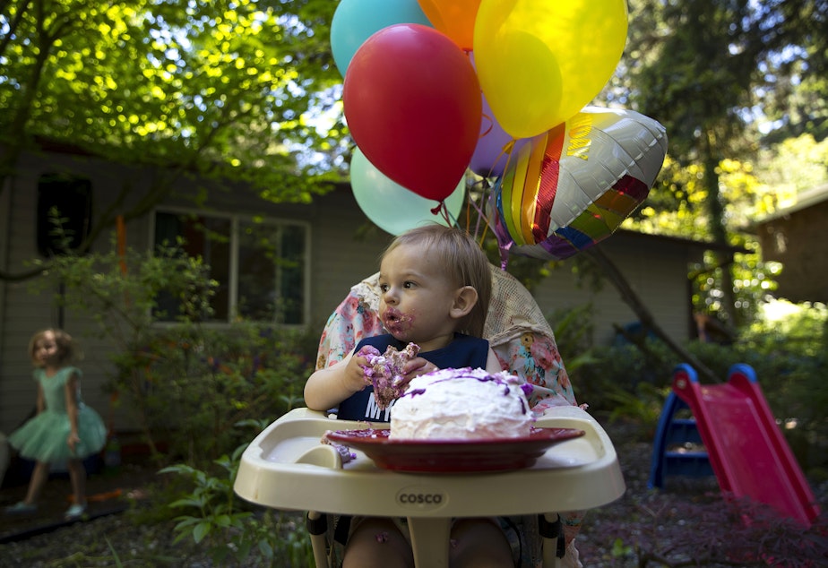 caption: Arlo Philip eats cake during his 1st birthday party on Saturday, May 29, 2021, at his home on Vashon Island.